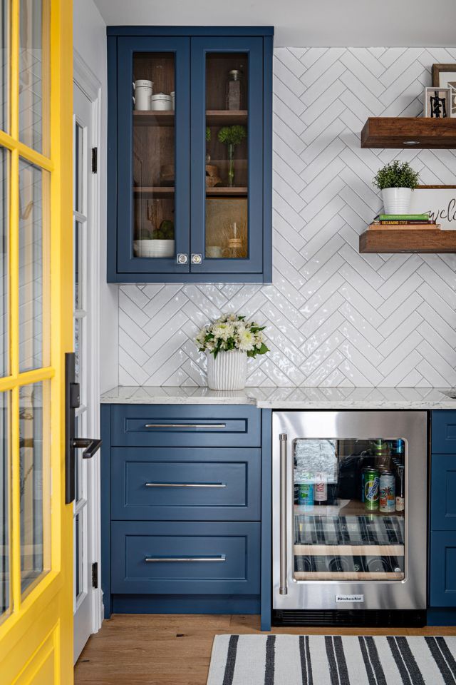 modern farmhouse kitchen with wood accents and colorful cabinetry